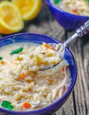 Greek avgolemono soup being spooned up