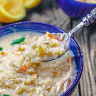 Greek avgolemono soup being spooned up