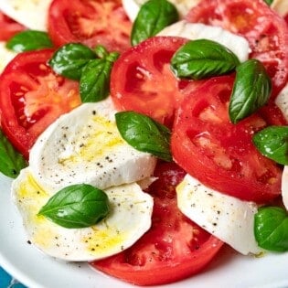 close up of a caprese salad on a platter.