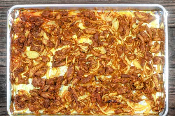 Baked chicken shawarma on baking sheet