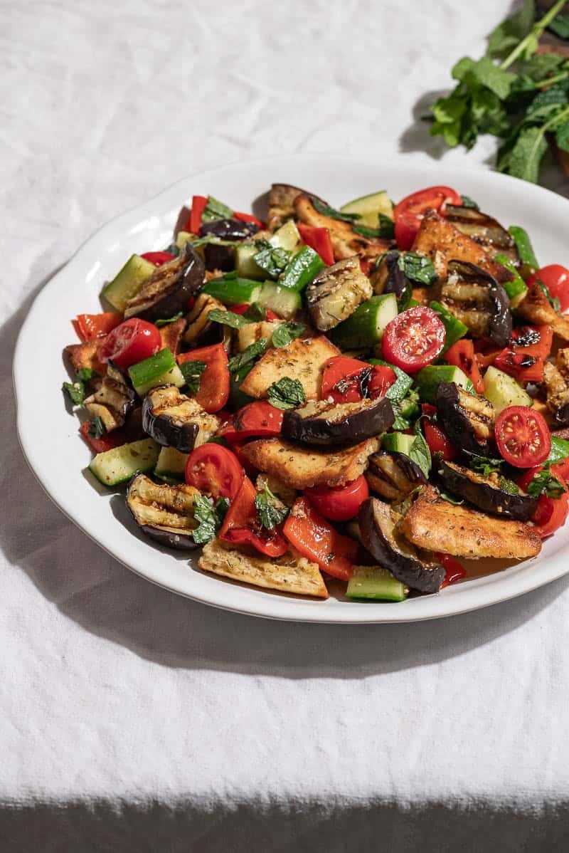 Grilled eggplant salad on a serving platter.