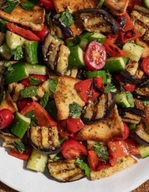 Grilled eggplant salad on a serving platter.