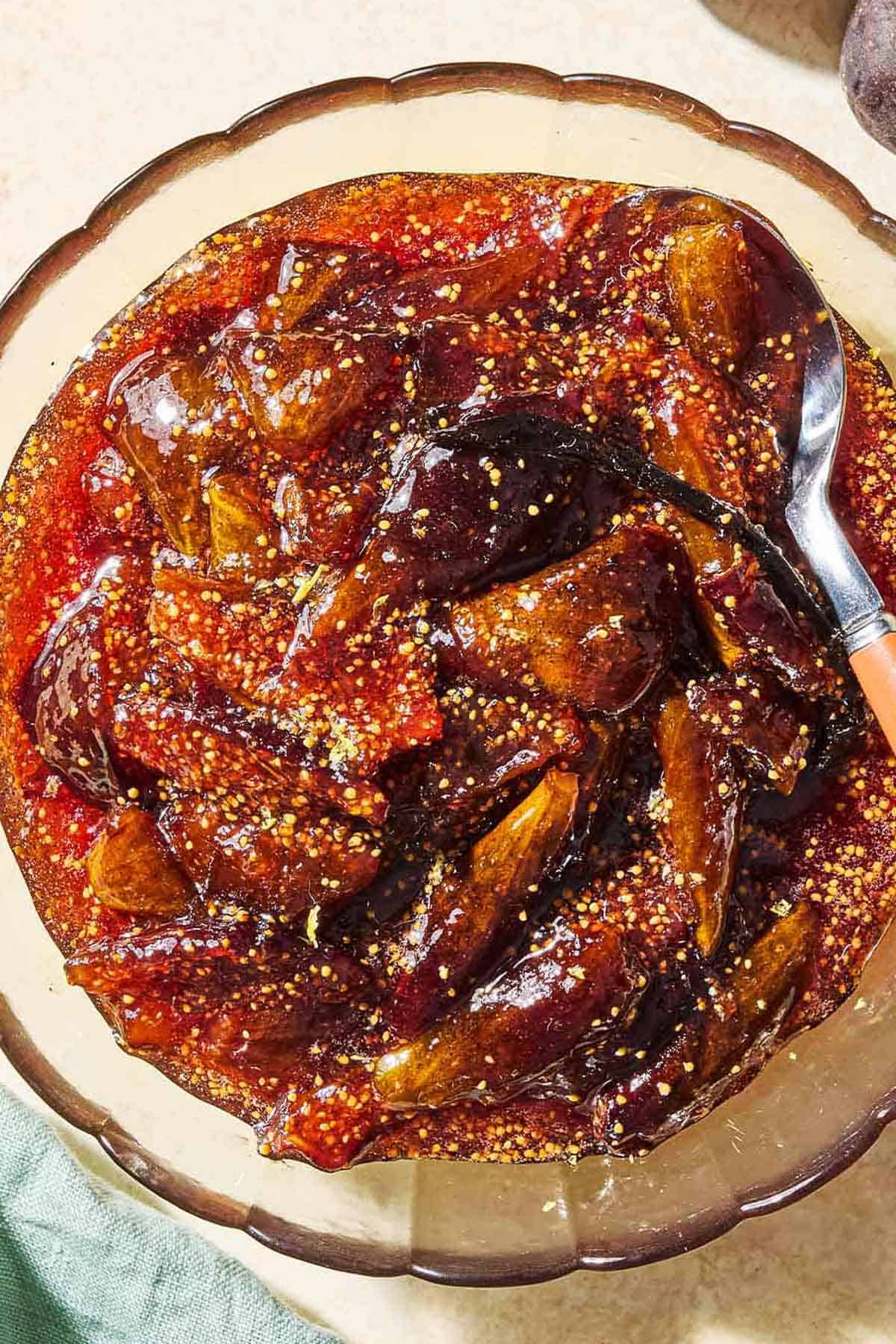 An overhead photo of fig jam in a bowl with a spoon.