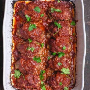 Greek Baked Meatballs with Red Sauce. Garnished with Parsley