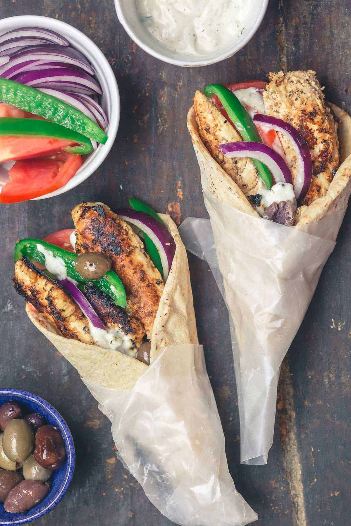 Chicken gyro wraps with tzatziki sauce, tomatoes and olives.