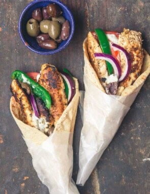 Chicken gyro wraps served with black and green olives.