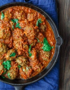 Lebanese-Style Meatballs Recipe in Tomato Sauce | The Mediterranean Dish. Juicy, tender meatballs, prepared Lebanese-style with notes of cinnamon and allspice, then braised in a tasty, thick tomato sauce. A couple simple ingredients take this meatballs recipe over the top. From TheMediterraneanDish.com #easyrecipe #meatballs #mediterraneanrecipe #mediterraneandiet #lebanese #meatballsrecipe #onepot