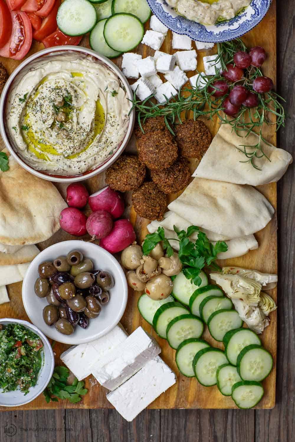 Mediterranean breakfast or brunch with falafel, hummus, baba ganoush,fresh vegetables and more