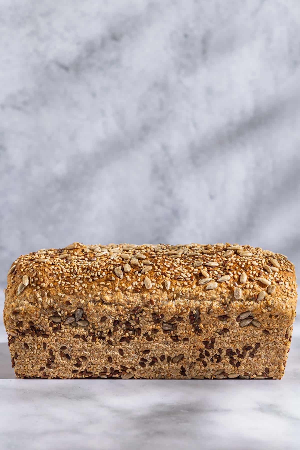 A close up of a loaf of whole wheat bread.