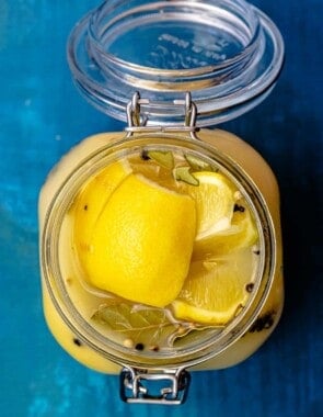 Top down picture of preserved lemons in a jar