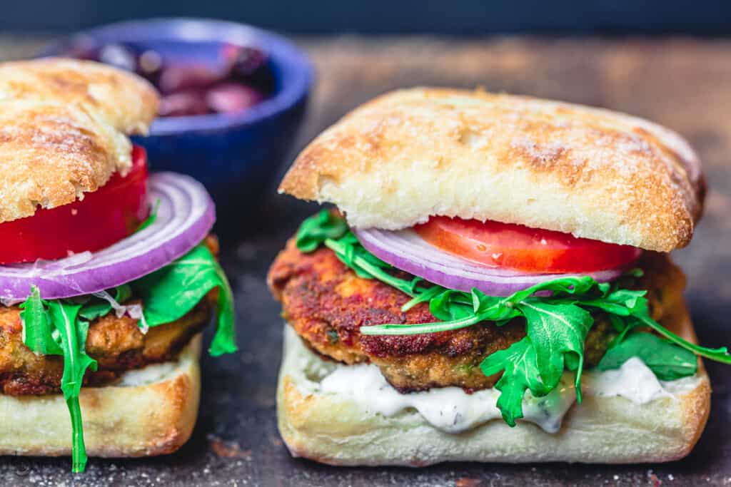 Mediterranean salmon burgers, assembled in ciabatta buns