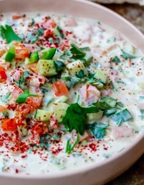 Tahini salad with cucumbers, tomatoes, parsley and aleppo pepper