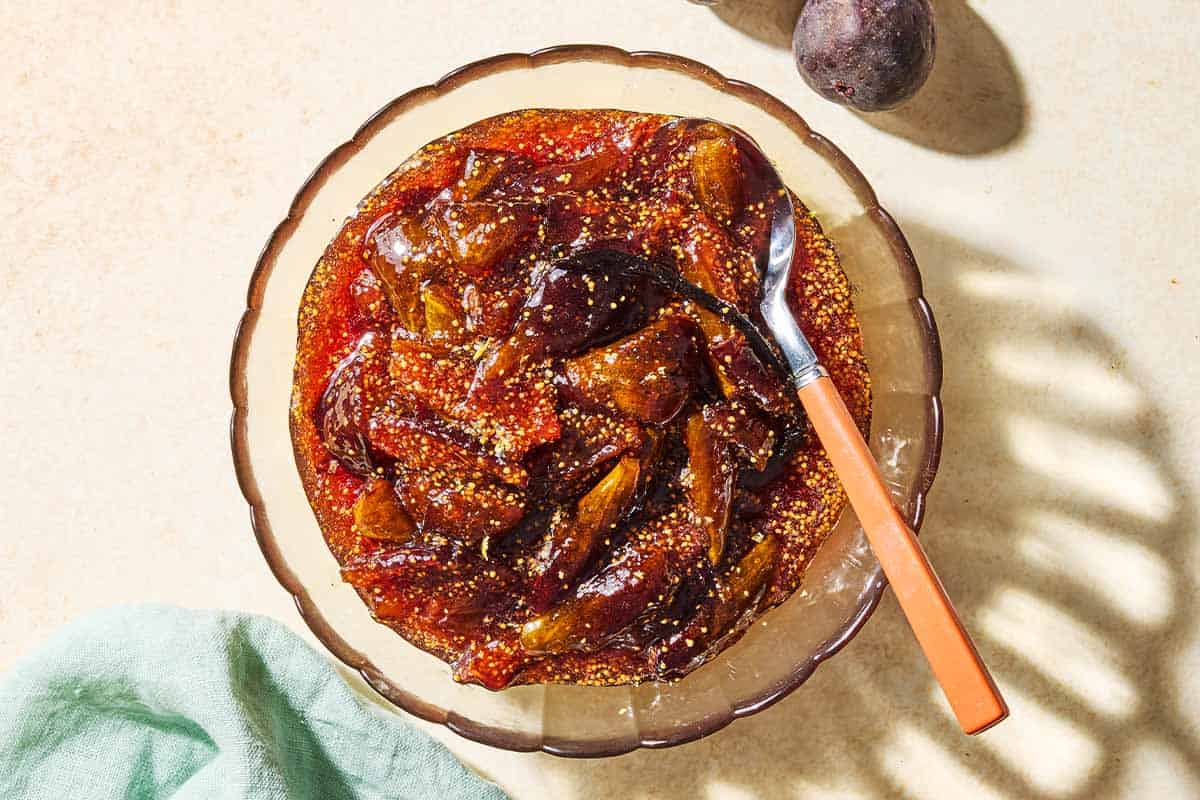 An overhead photo of fig jam in a bowl with a spoon.