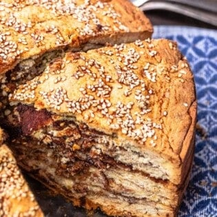 slice of vasilopita showing layers and cinnamon sugar mixture